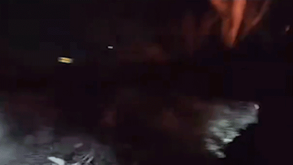 Driver narrowly escapes fiery car explosion as officers rush to rescue trapped man