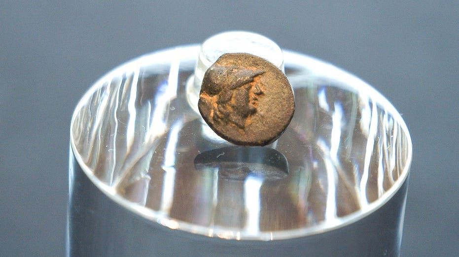 Teen stumbles on mysterious coin from legendary city, puzzling archaeologists over its journey